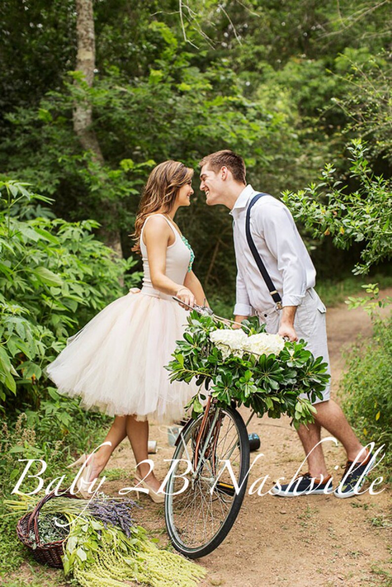 spring engagement photo idea with bicycle