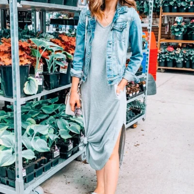 spring or summer outfit with grey maxi dress, jean jacket, and white sneakers