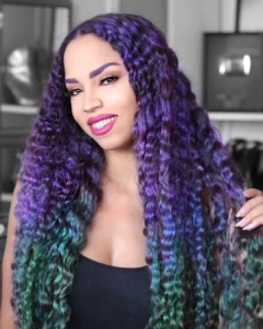 hispanic or black woman with green hair and purple eyebrows