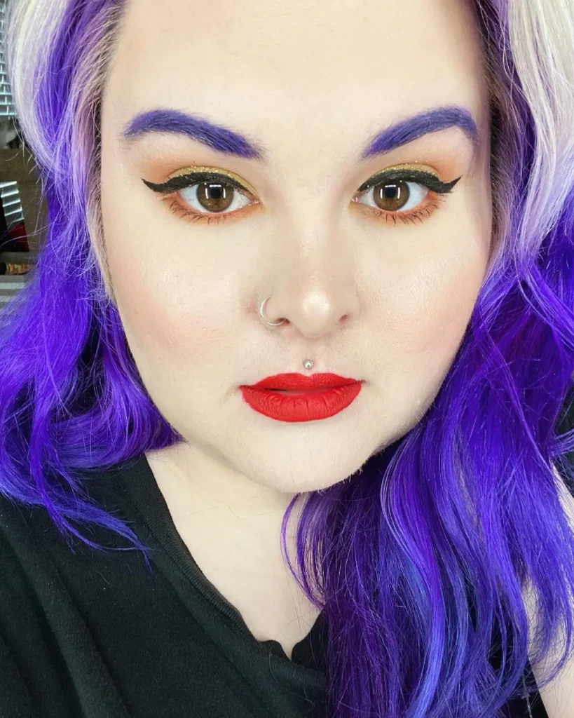 icy blonde and purple hair with purple eyebrows