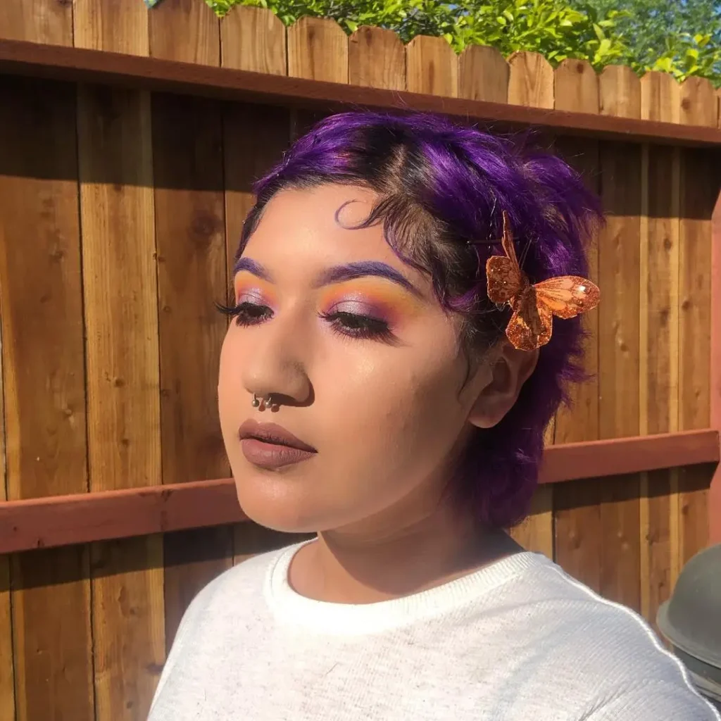 short black and purple hair with purple eyebrows