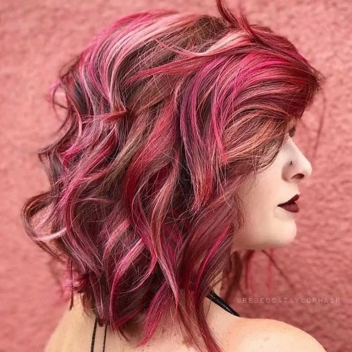 brown wavy hair with pink highlights