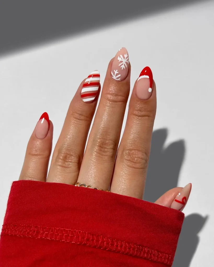 cute red and white Christmas nails with Santa hat and snowflakes