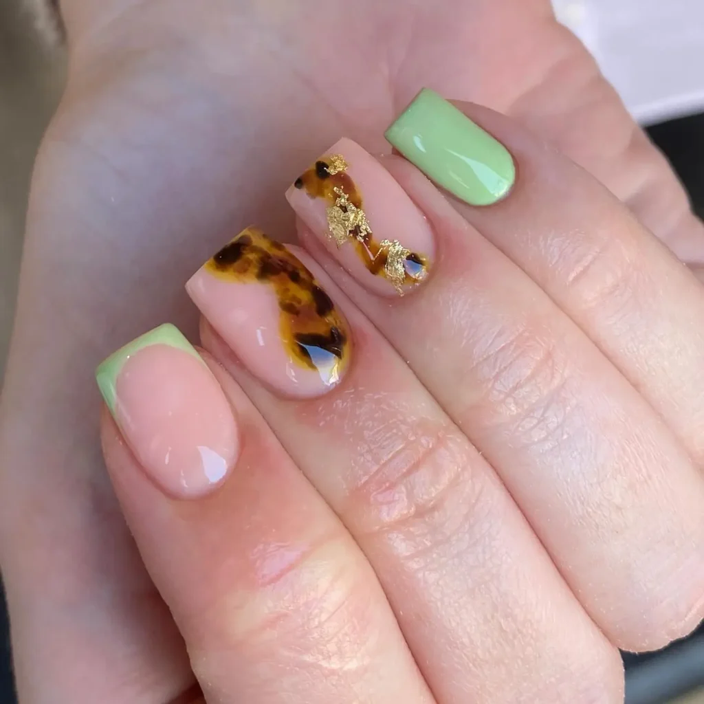 lime green, brown, and gold nails
