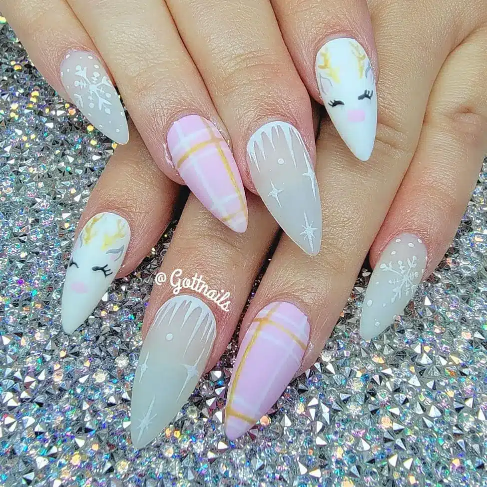 white and pink sleeping reindeer nails